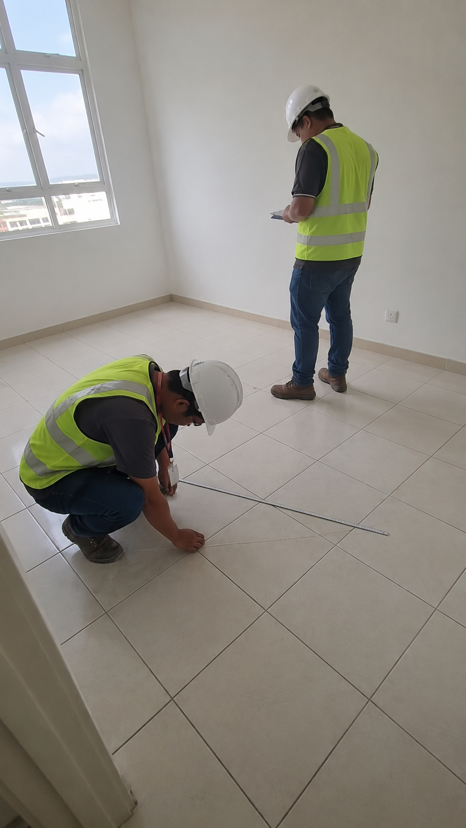 Asal Bina QA inspection — checking level at window